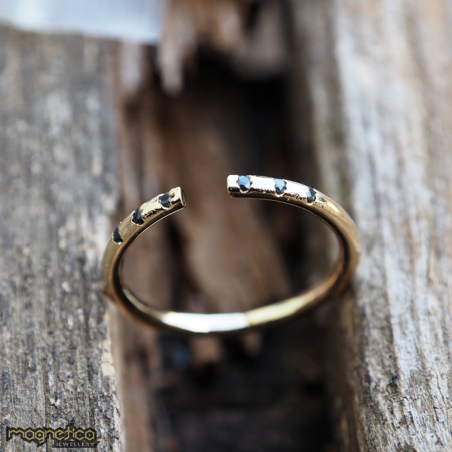 Gold black stones open ring